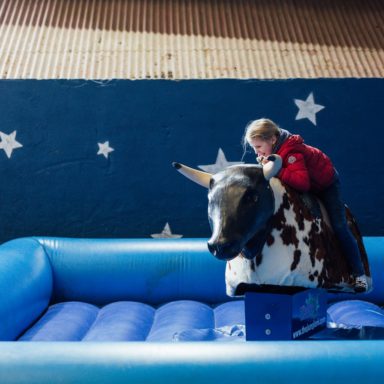 KAG   Rodeo Bull girl getting on