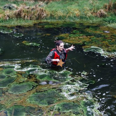 GMOOH   girl in pond with star   algae