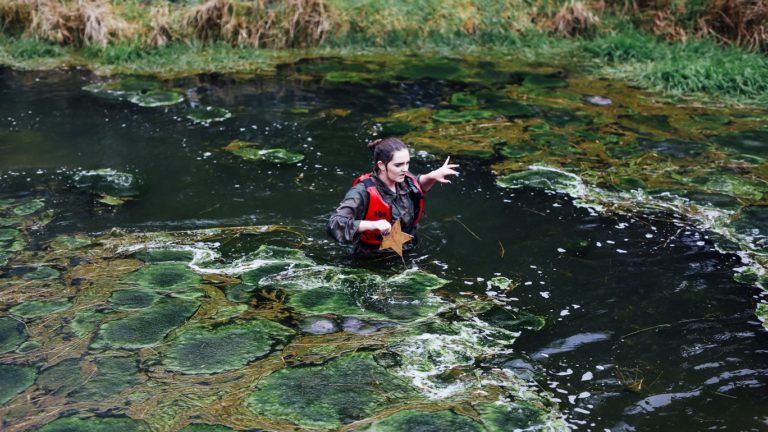 GMOOH   girl in pond with star   algae