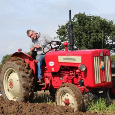 Mid Ulster Vintage rally guy on red tractor