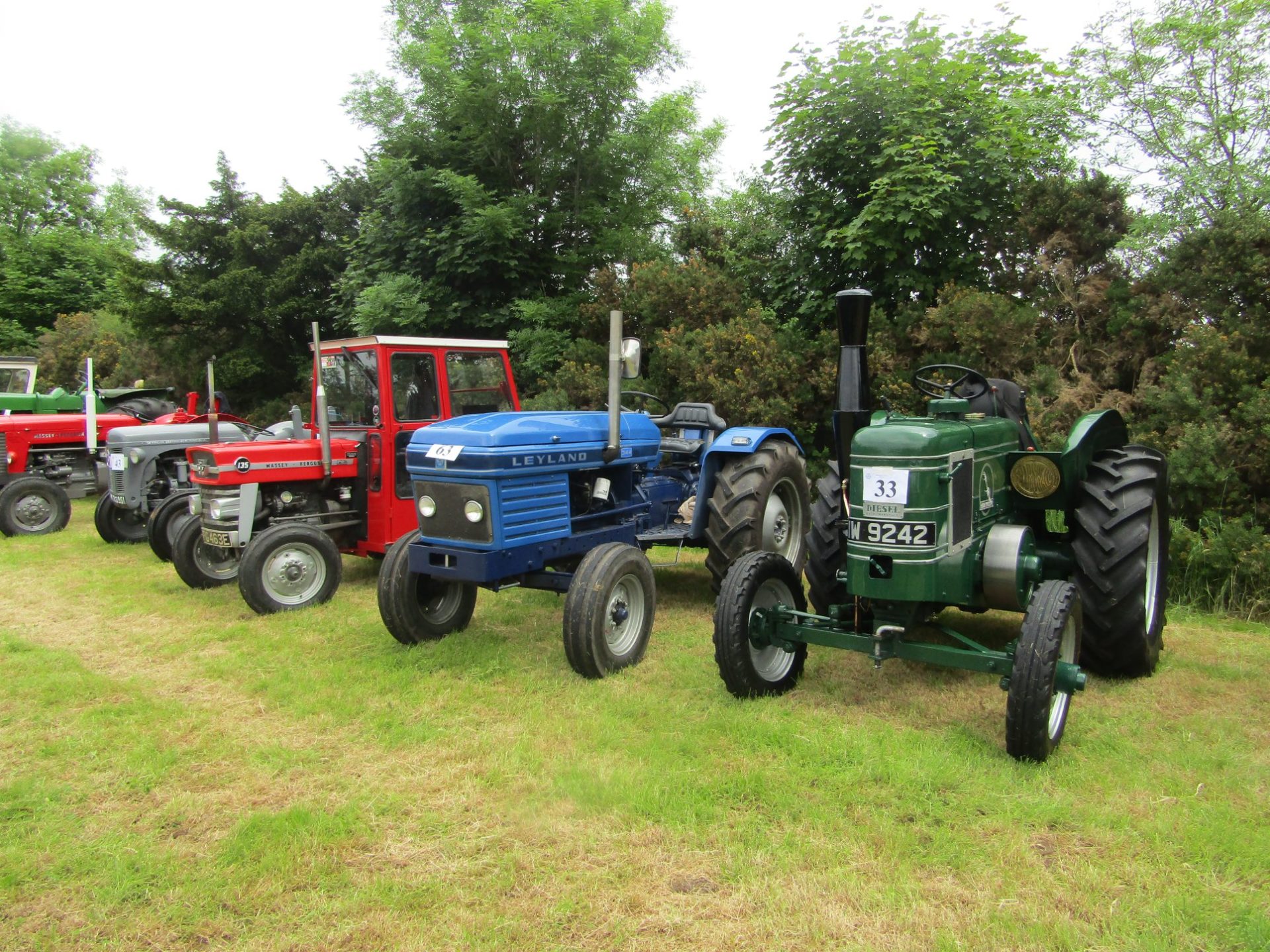 Mid Ulster Vintage rally tractors in a line